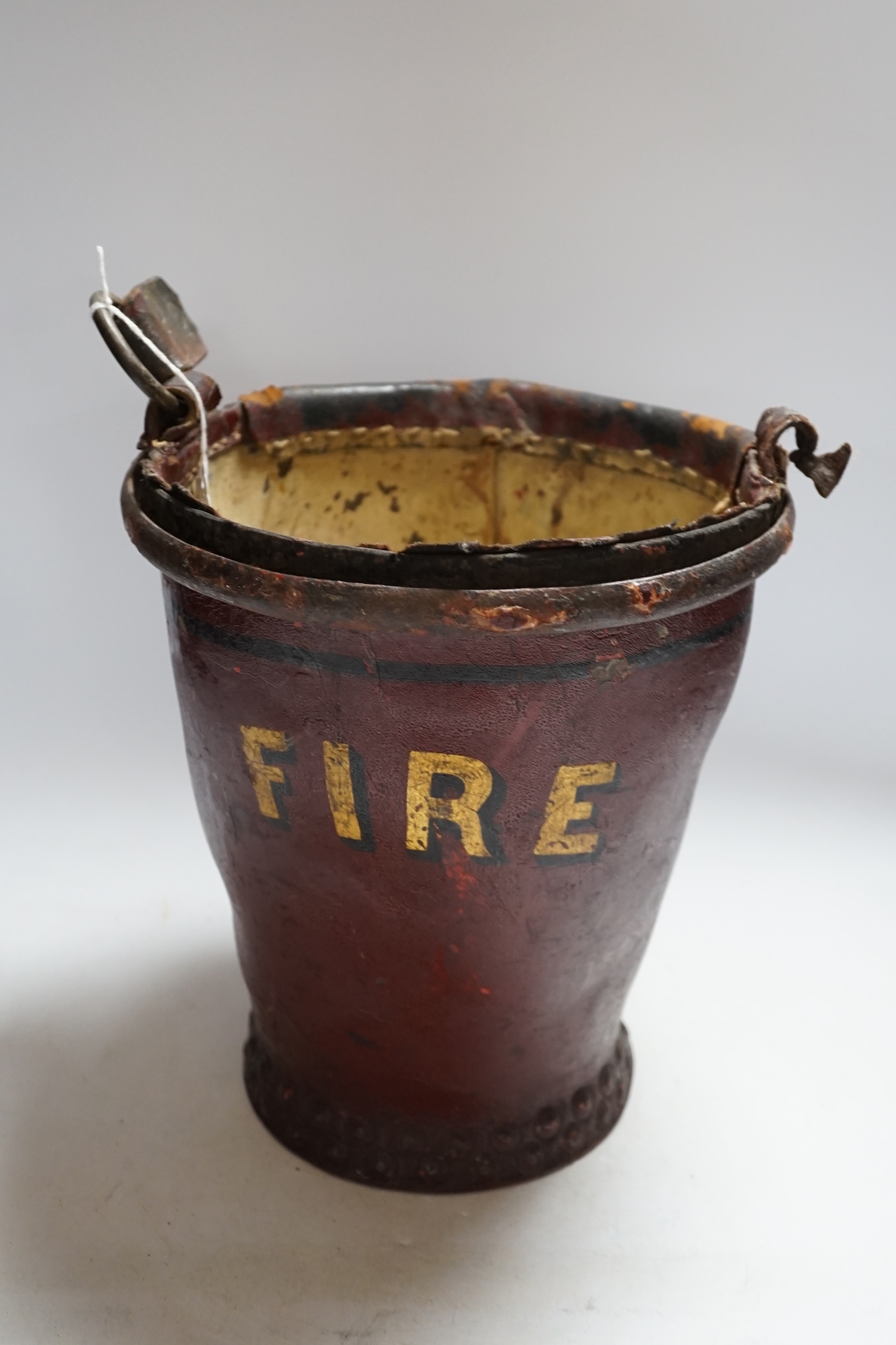 A Victorian leather fire bucket, 28cm high